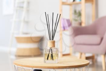 Reed diffuser on table in room�
