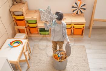 Little boy with toys at home�