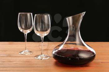 Decanter of wine and glasses on table�
