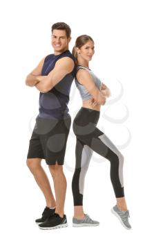 Sporty young couple on white background�