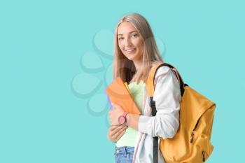 Beautiful student on color background�