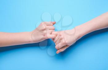 Pinky grip on color background. Unity concept�