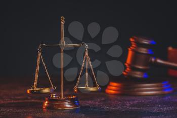 Scales of justice and gavel on table of notary public�
