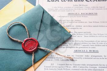 Envelope with notary public wax seal and document on table�