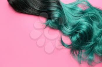 Unusual wig on color background�