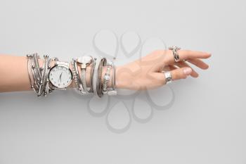 Female hand with stylish wrist watches on white background�