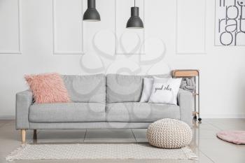 Stylish sofa in living room�