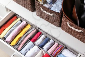 Open drawer with clean clothes in closet�