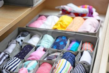 Open drawer with clean clothes in closet�