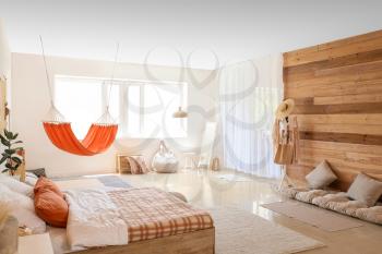 Interior of living bedroom with stylish hammock�