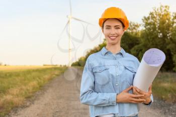 Female engineer on windmill farm for electric power production�