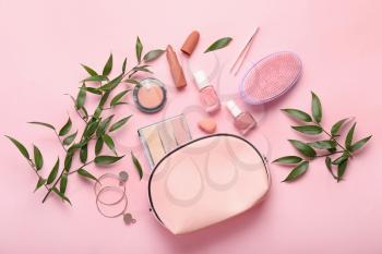 Set of decorative cosmetics and accessories on color background�
