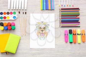 Composition with coloring picture on table�
