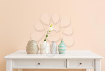 Beautiful vases with flower on light table�