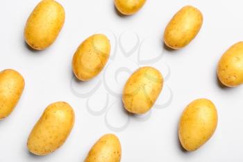 Raw potatoes on white background�