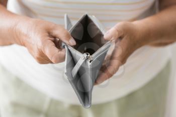 Senior woman showing empty wallet, closeup. Concept of pension�