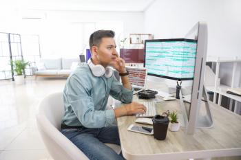 Male programmer working in office�