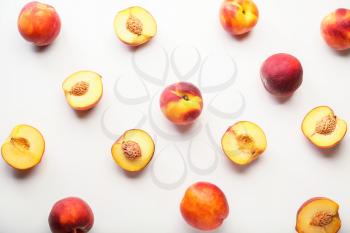 Sweet ripe peaches on white background�