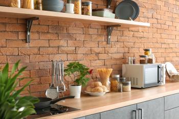 Interior of modern kitchen with shelves�