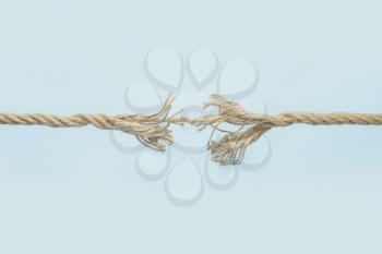 Frayed rope on color background�