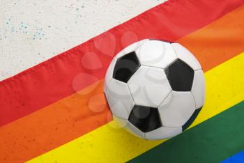 Soccer ball and rainbow LGBT flag�