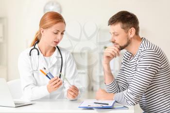 Diabetic man visiting doctor in clinic�