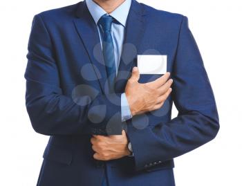Elegant man in suit with blank badge on white background�