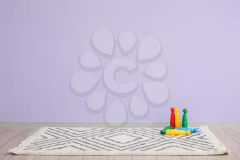 Skittles on soft carpet near color wall in room�