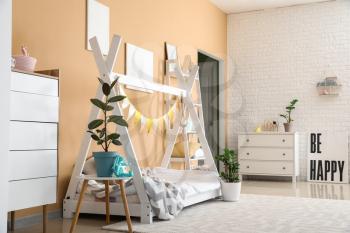 Interior of modern children's room with stylish bed�