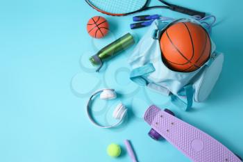 Set of sports equipment on color background�