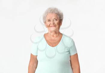Portrait of senior woman on white background�