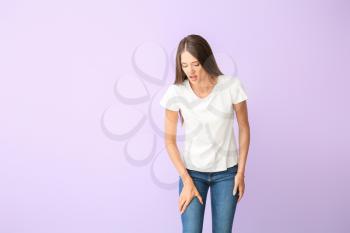 Woman with problem of limbs numbness on color background. Diabetes symptoms�