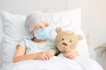 Little girl undergoing course of chemotherapy in clinic�
