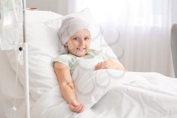 Little girl undergoing course of chemotherapy in clinic�