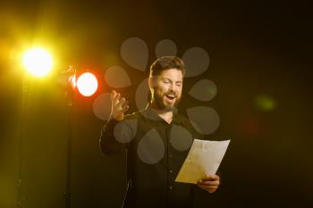 Male actor performing on stage�