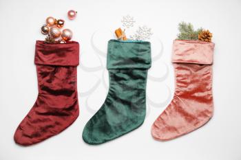 Composition with Christmas socks on white background�