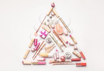 Christmas composition with cosmetics on light background�