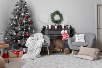 Decorated fireplace in interior of room on Christmas eve�