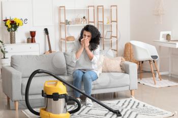 Allergic woman cleaning her flat�