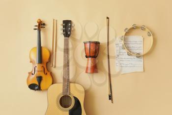 Different musical instruments and music notes on color background�