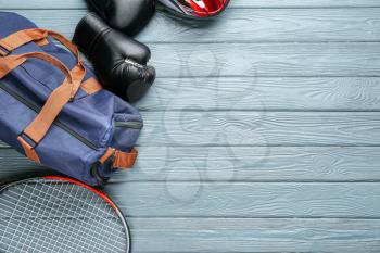 Set of sports items on wooden background�