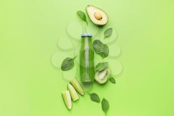 Composition with bottle of healthy green smoothie and ingredients on color background�