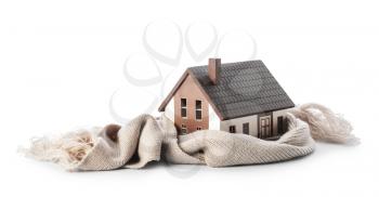 Figure of house and warm scarf on white background. Concept of heating season�