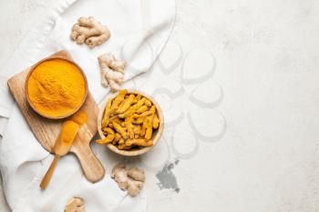 Composition with turmeric powder on grunge background�