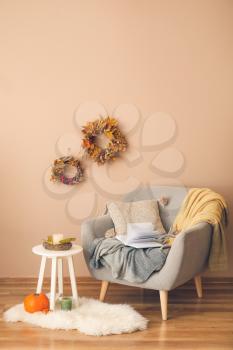 Stylish interior of living room with autumn decor�