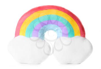Soft pillow in shape of rainbow on white background�