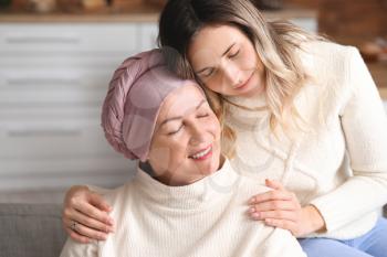 Daughter visiting her mother after chemotherapy at home�