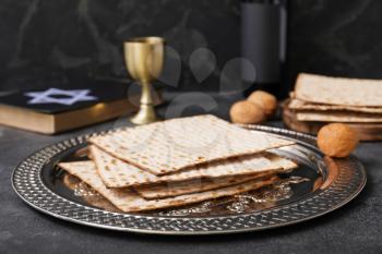 Passover Seder plate with matzo on dark background�