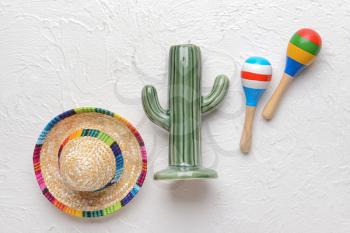 Cactus, maracas and sombrero hat on light background�