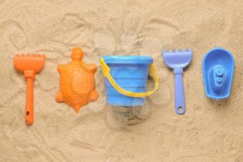 Set of beach toys for children on sand�